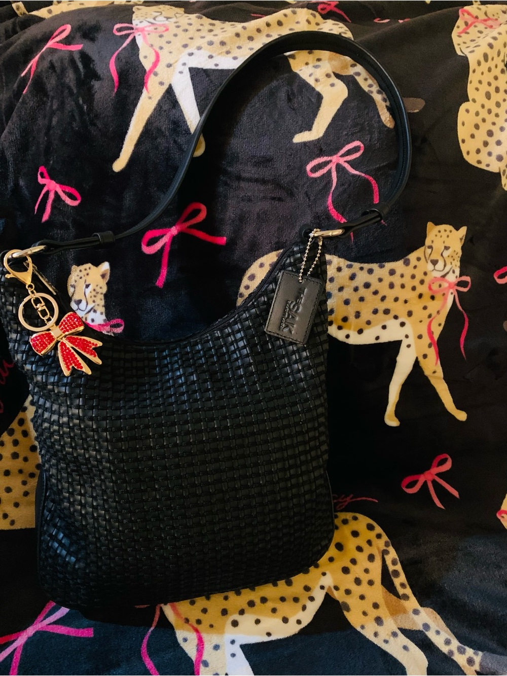 Shoulder Bag Woven Faux Leather The Sak in Black Size Small with bow bag charm